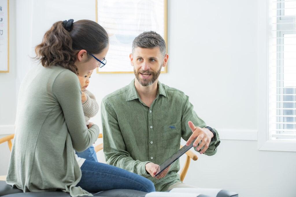 Chiropractor explaining findings